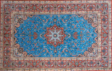 El düğümlü ve karmaşık bir şekilde tasarlanmış İran İsfahan Halısı.
