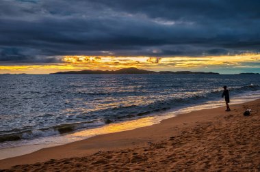 Stormy tropical skies at a beach near Pattaya, Thailand during the monsoon rainy season can produce spectacular sunsets