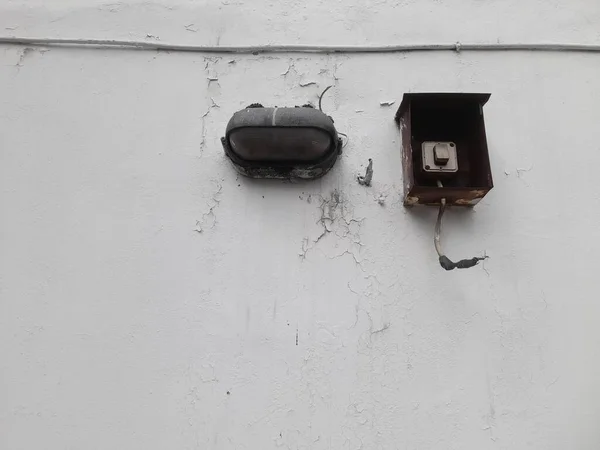 box shaped electric switch from a distance. on a white background. electrical installation background concept, electronics, electric voltage, electric shock, dangerous symbols, home interior, industry