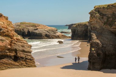 the pleasure of walking in the sand enjoying the sound of waves
