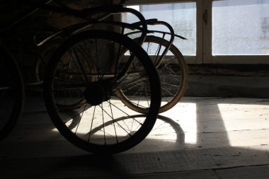 the shadows of my baby stroller in the attic