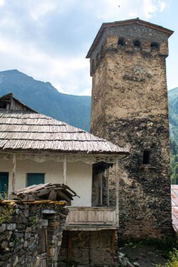 Typical Georgian house with its svan tower in the village of Adishi. Mestia-Ushguli trekking, Georgia. 