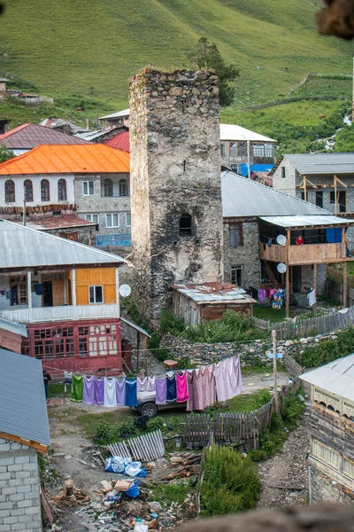 Svan tower surrounded by characteristic houses in the village of Adishi. The Mestia-Ushguli trek, Georgia.