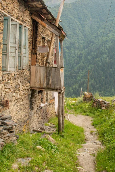 Typical house in the Caucasus Mountains. Wood, bricks. Mestia-Ushguli trekking trail, Georgia.