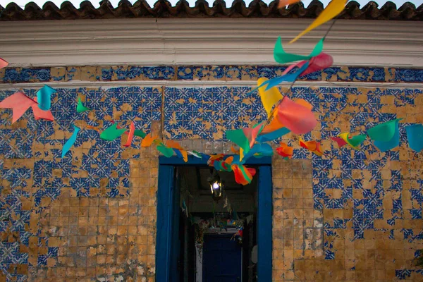 Colorful banners over an open door at the Casa de Azulejos, in Sao Pedro da Aldeia, Cabo Frio, Brazil.