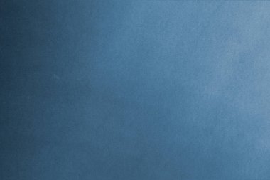 Mavi kağıt desenli arka planda beyaz lekeler ve kir var. Gradyan ışık. Metni girmek için kopyalama alanı olan üst görünüm.