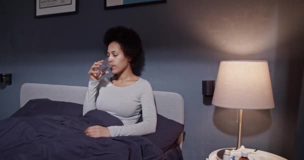 Sick black woman drinking water — Wideo stockowe