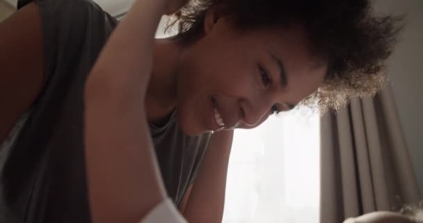 Cute Kid Embracing Happy Black Mother Awakening Morning — Vídeo de stock