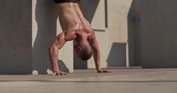 Strong Sportsman Doing Handstand Push Ups Wall Sports Ground — Vídeos de Stock