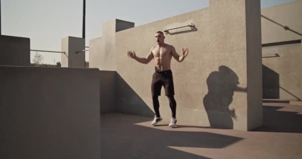 Athlete Doing Jumping Jacks Concrete Wall Aerobic Training — Vídeos de Stock