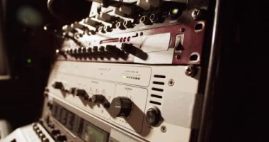 Professional modern amplifier during music recording process in studio