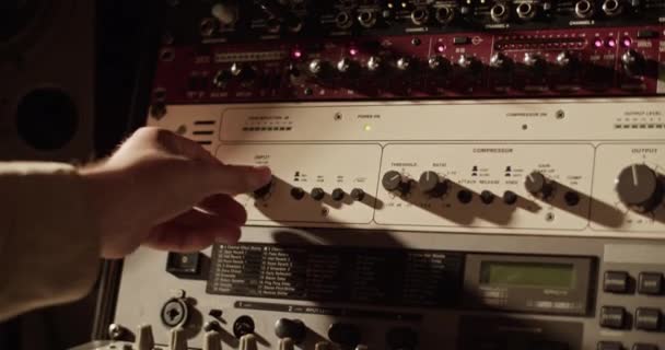 Cropped Producer Adjusting Switch Amplifier Recording Studio — Vídeo de stock
