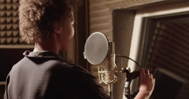 Black Woman Putting Headphones Microphone Recording Studio — Αρχείο Βίντεο