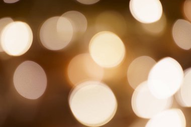 Turuncu ışığın yarattığı güzel bokeh desenli arka plan. : Bulanık