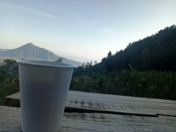 coffee cup on the background of the mountains