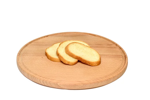 木架上的三片面包被白色背景隔开了 切碎的面包放在木板上 — 图库照片