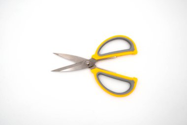 Yellow grey handle scissors isolate on white background. Paper, art, multipurpose cutting.