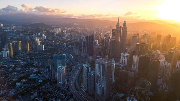 Kuala Lumpur / Malaysia, Jan 4, 2020 : Sunrise aerial view with sun ray of KLCC from a drone.