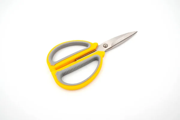 Yellow grey handle scissors isolate on white background. Paper, art, multipurpose cutting.
