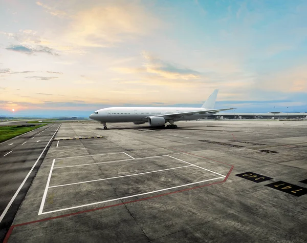 plane parked at the airport with beautiful sunset view