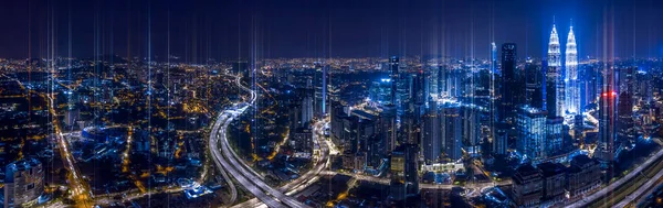 Network and Connection technology conceptual image with virtual interface against night glowing city