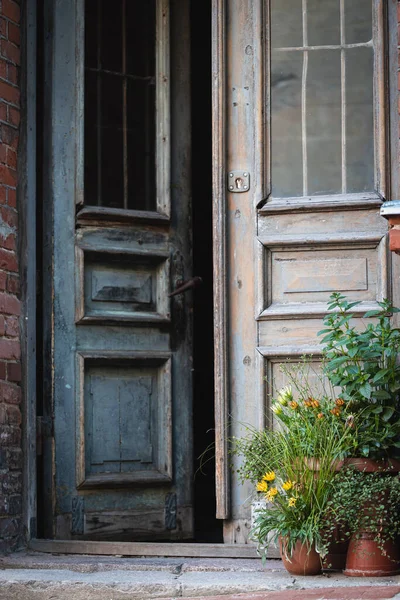 Opened old wooden door in antique blue color