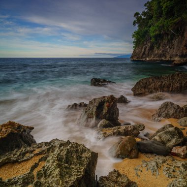 Base G beach view with rocks eroded by waves