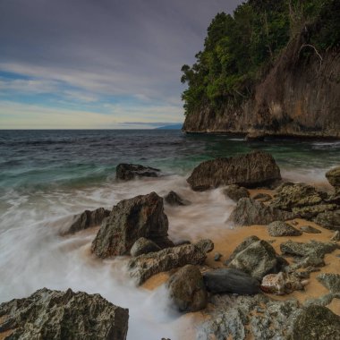 Base G beach view with rocks eroded by waves