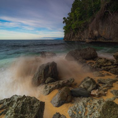 Base G beach view with rocks eroded by waves