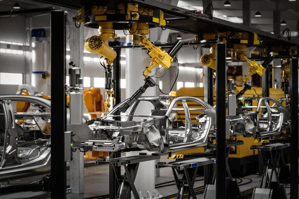 Robotic welding production line in car factory. Computer generated image of a vehicle manufacturing company.