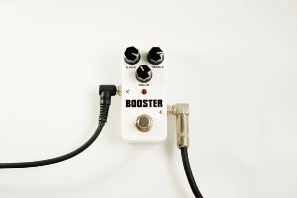pedal effect booster guitar with cable plugged on white background