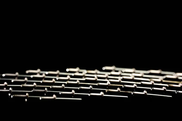 rivet nails arranged in lines on black background