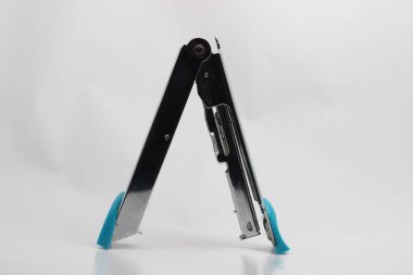 Stainless steel stapler on a white background. 