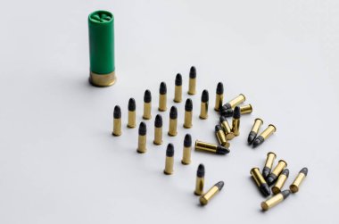 high angle view of bullets and shotgun shell on white background  clipart