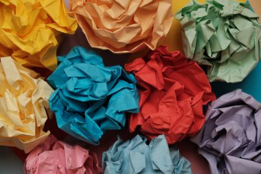 balls of crumpled colored paper in the form of a rose