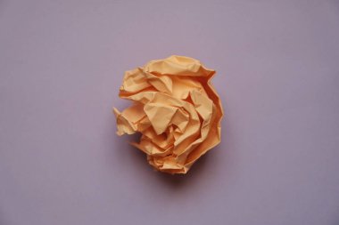 a ball of crumpled colored paper in the form of a rose