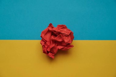ball of colored paper in the form of a rose yellow-blue