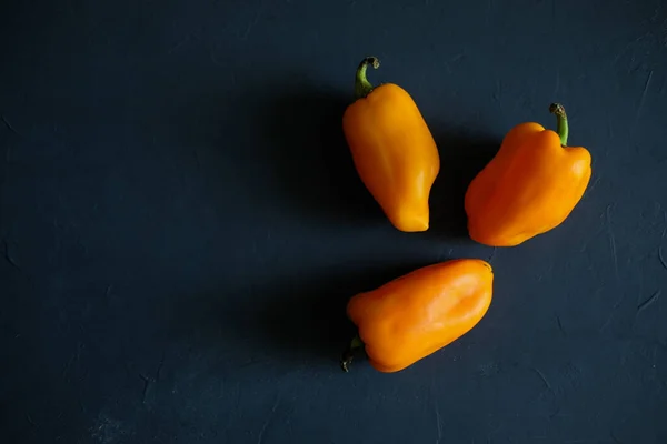 Yellow sweet bell pepper on gray background