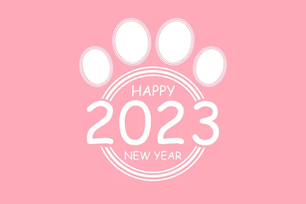 猫爪贴纸2023标题 新年快乐2023 2023 粉色背景的贺卡 图库图片