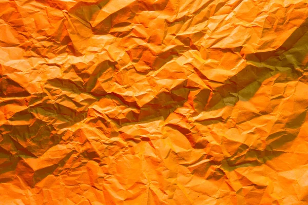 Photo Crumpled Wrinkled Orange Office Paper Lit Red Light Background — Stock Photo, Image