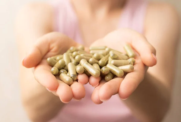 Handful Green Kratom Pills Woman Hands Face Selective Focus — Stock Photo, Image