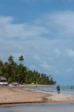 Brazil, Alagoas, 2021, january 21st A long beach with tourists enjoying a summer day in northeast Brazil