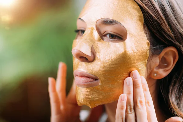 Woman Golden Aging Face Mask — стоковое фото