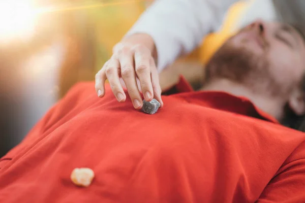 Alternative Medicine Young Man Having Chakra Healing Crystal Treatment — стоковое фото