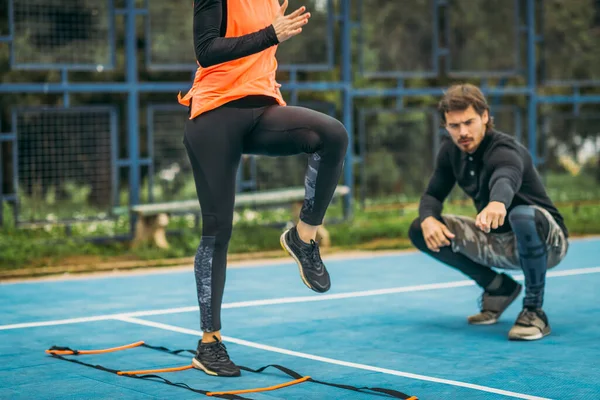 Young Woman Exercising Personal Fitness Coach Using Agility Ladder Agility — Foto de Stock