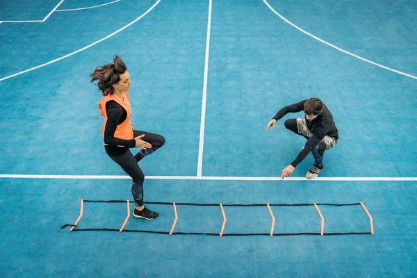 Young Woman Exercising Personal Fitness Coach Using Agility Ladder Agility — 스톡 사진