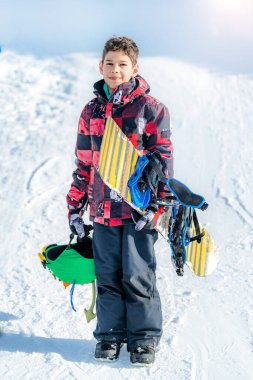 Portrait of Boy with Snowboard