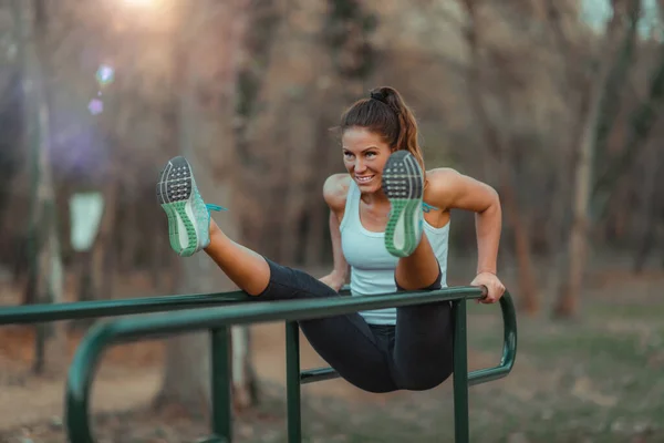 Woman Exercising Parallel Bars Park — Zdjęcie stockowe