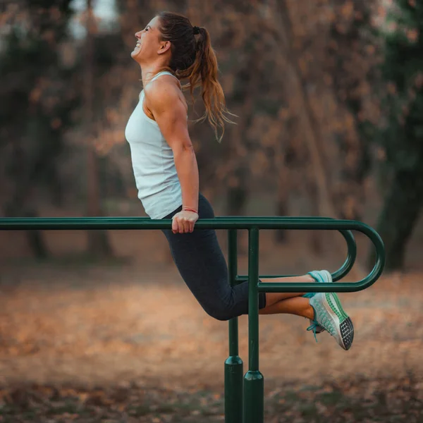 Woman Exercising Parallel Bars Park — 图库照片