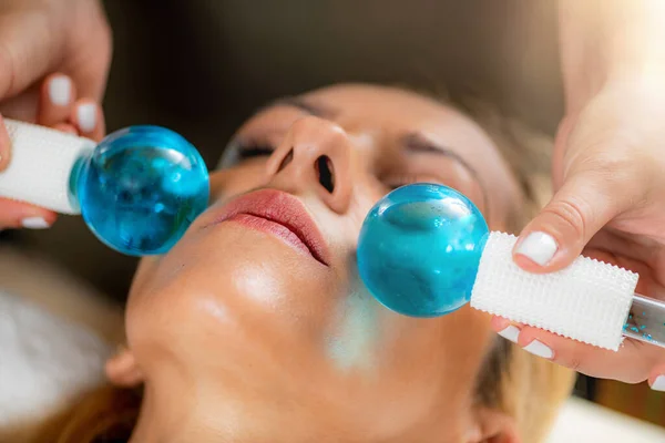 Face massage with ice crystal balls
